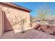 Inviting outdoor patio area with pavers and a mature tree, perfect for relaxing at 4365 S Columbine Way, Gold Canyon, AZ 85118