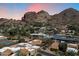 Scenic aerial view of a neighborhood nestled amidst stunning rock formations and desert landscape at 4448 E Camelback Rd # 16, Phoenix, AZ 85018