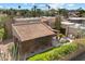 Aerial view of the property showcasing lush landscaping, a grill, and a red tile roof at 4448 E Camelback Rd # 16, Phoenix, AZ 85018