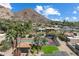Aerial view showcasing a tennis court and a putting green, with mountain views in the background at 4448 E Camelback Rd # 16, Phoenix, AZ 85018