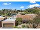 Aerial view highlighting the red tile roof and private garage of this desert property at 4448 E Camelback Rd # 16, Phoenix, AZ 85018