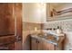 Close-up on bathroom vanity featuring mosaic tile backsplash and granite countertop at 4448 E Camelback Rd # 16, Phoenix, AZ 85018