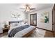 This bedroom features two pieces of art, a ceiling fan, wood trim, and shutters at 4448 E Camelback Rd # 16, Phoenix, AZ 85018