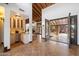 Grand entrance featuring custom wrought iron doors, beautiful tile flooring, and a convenient wet bar for elegant entertaining at 4448 E Camelback Rd # 16, Phoenix, AZ 85018