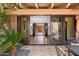 Inviting entrance view showcasing a glimpse of the elegant foyer and stylish interiors, blending indoor and outdoor spaces seamlessly at 4448 E Camelback Rd # 16, Phoenix, AZ 85018