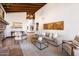 Stylish living room showcases a cozy seating area, stone fireplace, and elegant decor for relaxed gatherings at 4448 E Camelback Rd # 16, Phoenix, AZ 85018