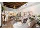 Bright, open living area with a stone fireplace, views to the outdoors, and seamless access to the kitchen at 4448 E Camelback Rd # 16, Phoenix, AZ 85018