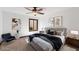 This primary bedroom is well lit and decorated with modern decor, including neutral tones and textures at 4448 E Camelback Rd # 16, Phoenix, AZ 85018