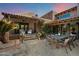 Inviting outdoor patio with elegant dining set and comfortable seating area, perfect for entertaining guests at 4448 E Camelback Rd # 16, Phoenix, AZ 85018