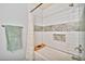 Bathroom with white subway tile in shower and decorative tile accent and niche at 4530 E Vista Dr, Phoenix, AZ 85032