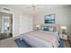 Tastefully furnished bedroom showcases stylish décor, ceiling fan, and closet at 4530 E Vista Dr, Phoenix, AZ 85032