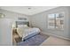 Tastefully furnished bedroom showcases stylish décor, rug, and window at 4530 E Vista Dr, Phoenix, AZ 85032