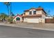 Attractive home with a neutral color scheme, red tile roof, and low maintenance desert landscaping at 4530 E Vista Dr, Phoenix, AZ 85032