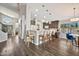 Open-concept kitchen with a breakfast bar, pendant lighting, and modern appliances overlooking the entry at 4530 E Vista Dr, Phoenix, AZ 85032