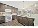 Stylish kitchen with sleek cabinetry, modern appliances, and a bright window over the sink at 4530 E Vista Dr, Phoenix, AZ 85032