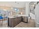 Well-designed kitchen with a breakfast bar, stainless steel appliances, and modern lighting fixtures at 4530 E Vista Dr, Phoenix, AZ 85032