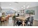 Open-concept living area with dining table, hardwood floors, comfortable seating, and natural light at 4530 E Vista Dr, Phoenix, AZ 85032