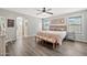 Serene main bedroom with neutral tones, ample natural light, and an ensuite bathroom at 4530 E Vista Dr, Phoenix, AZ 85032