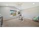Home office with hardwood floors, comfortable chair, and large window providing outdoor views at 4530 E Vista Dr, Phoenix, AZ 85032
