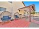 Covered patio with dining set and comfortable seating, perfect for outdoor entertaining and relaxation at 4530 E Vista Dr, Phoenix, AZ 85032