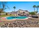 Backyard boasts a private pool, mature landscaping, and inviting lounge area at 4530 E Vista Dr, Phoenix, AZ 85032