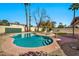 Backyard boasts a private pool, mature landscaping, and lounge chairs at 4530 E Vista Dr, Phoenix, AZ 85032