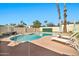 Backyard boasts a private pool, mature landscaping, and lounge chairs at 4530 E Vista Dr, Phoenix, AZ 85032