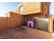 Fenced backyard features a small dog house and storage shed, offering space for various outdoor activities at 4615 E Southgate Ave, Phoenix, AZ 85040
