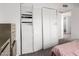Bedroom featuring closet with sliding doors, light-colored walls, and carpet flooring at 4615 E Southgate Ave, Phoenix, AZ 85040