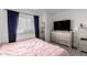 Cozy bedroom with a large window, ample natural light, and neutral decor at 4615 E Southgate Ave, Phoenix, AZ 85040