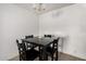 Dining room featuring a black table and four chairs under a chandelier at 4615 E Southgate Ave, Phoenix, AZ 85040