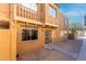 Two-story condo featuring a secure entryway and a small, private balcony at 4615 E Southgate Ave, Phoenix, AZ 85040