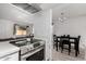 Updated kitchen with stainless steel appliances with a combined dining area at 4615 E Southgate Ave, Phoenix, AZ 85040