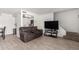 Living room with tile floors, plus view of kitchen and stairway at 4615 E Southgate Ave, Phoenix, AZ 85040