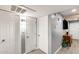 Hallway with multiple white doors, gray walls, and wood-look flooring at 4730 W Northern Ave # 1102, Glendale, AZ 85301