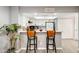 Kitchen featuring a breakfast bar with seating and an array of cabinets at 4730 W Northern Ave # 1102, Glendale, AZ 85301