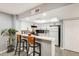 Kitchen with breakfast bar, white cabinets, and stainless steel appliances at 4730 W Northern Ave # 1102, Glendale, AZ 85301