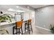 Kitchen with breakfast bar featuring seating for two and white cabinets at 4730 W Northern Ave # 1102, Glendale, AZ 85301