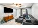 Cozy living room with a large sectional sofa, modern TV and light, gray walls at 4730 W Northern Ave # 1102, Glendale, AZ 85301