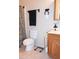 A clean bathroom featuring a toilet, vanity, and towel rack at 504 W Hartford Rd, Kearny, AZ 85137