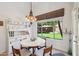 Cozy breakfast nook featuring a white table, window views, and charming hutch at 5102 E Libby St, Scottsdale, AZ 85254