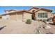 Charming home featuring desert landscaping, a two-car garage, and a decorative arched entryway at 5102 E Libby St, Scottsdale, AZ 85254