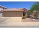 Inviting single-Gathering home featuring a well-manicured front yard and a spacious three-car garage at 5102 E Libby St, Scottsdale, AZ 85254