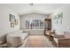 Cozy living room with comfortable seating, large windows, and natural lighting at 5102 E Libby St, Scottsdale, AZ 85254