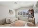Bright living room with neutral tones, shuttered windows, and cozy seating arrangement at 5102 E Libby St, Scottsdale, AZ 85254