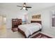 Spacious main bedroom with ceiling fan, tiled floors, and ample natural light at 5102 E Libby St, Scottsdale, AZ 85254