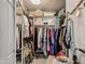 Bright walk-in closet with ample built-in shelving and storage spaces at 5102 E Libby St, Scottsdale, AZ 85254