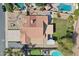 Overhead view of a backyard featuring a pool, well-kept lawn, and multiple outdoor living spaces at 5704 E Estrid Ave, Scottsdale, AZ 85254