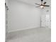 Spacious bedroom with modern ceiling fan, tiled floors, and plenty of natural light at 5704 E Estrid Ave, Scottsdale, AZ 85254