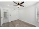 Bright bedroom with a ceiling fan, a closet, and wood floors at 5704 E Estrid Ave, Scottsdale, AZ 85254
